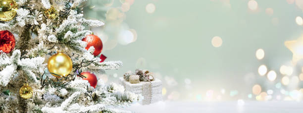 istock Beautiful festive widescreen background image with a decorated Christmas tree and a gift. 1578822118