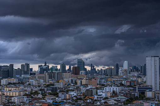 city of Bangkok in Thailand before the storm in coming the twilight sky , rainy season thick clouds cover the city, global warming concept