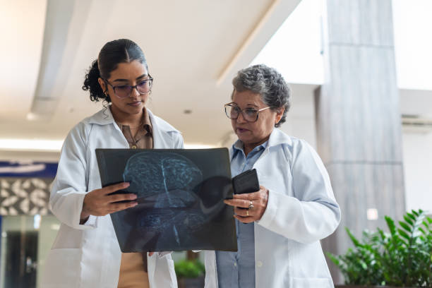 istock Two female doctors talking in a hallway 1578845407
