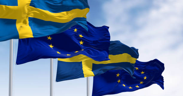 the flags of sweden and the european union waving together on a clear day - day sky swedish flag banner imagens e fotografias de stock