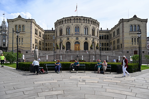 Oslo, Norway, July 3, 2023 - The Norwegian Parliament building (Stortinget) on Karl Johan Street (Karl Johans Gate) in Oslo.