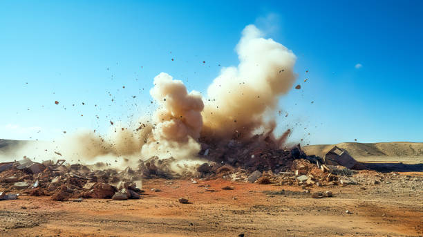 Dust storm after detonator blasting Rock dust clouds and debris during detonator blast on the construction site in the middle east bomb stock pictures, royalty-free photos & images