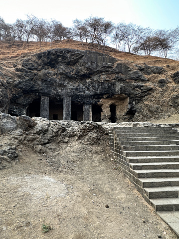 Stock photo showing close-up view of stone steps leading to temple dedicated to the Hindu god Shiva hewn from basalt rock.