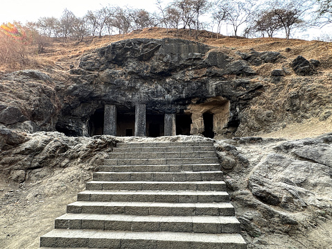 Stock photo showing close-up view of stone steps leading to temple dedicated to the Hindu god Shiva hewn from basalt rock.