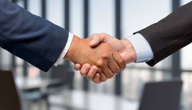 istock Business people shaking hands in an office 1578985597