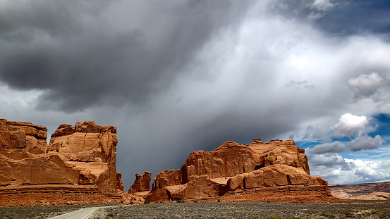 Storm clouds rolling over the red rocks of Arches National Park, Utah.