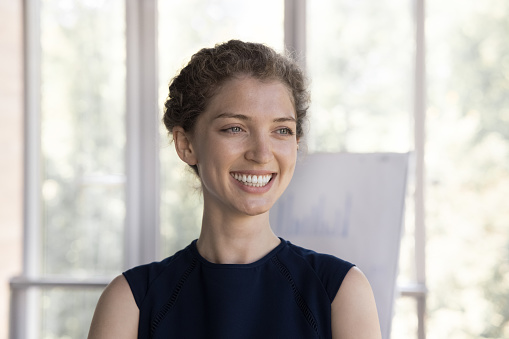 Happy beautiful young office employee girl candid portrait