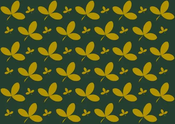 Vector illustration of Seamless pattern with yellow leaves on the green background.