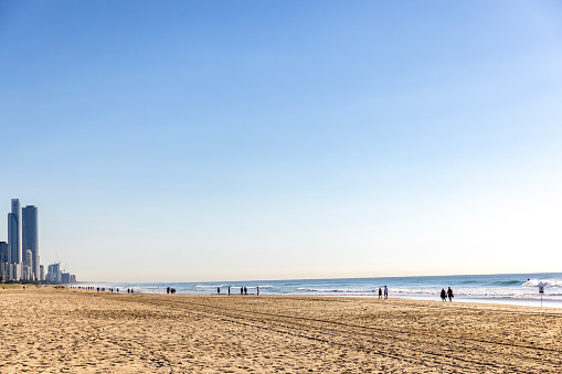 People enjoying sunny day at the beach, background with copy space, Queensland, Gold Coast Broadbeach, full frame horizontal composition