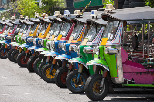 Row of Thai Tuk-tuks. Bangkok, Thailand.