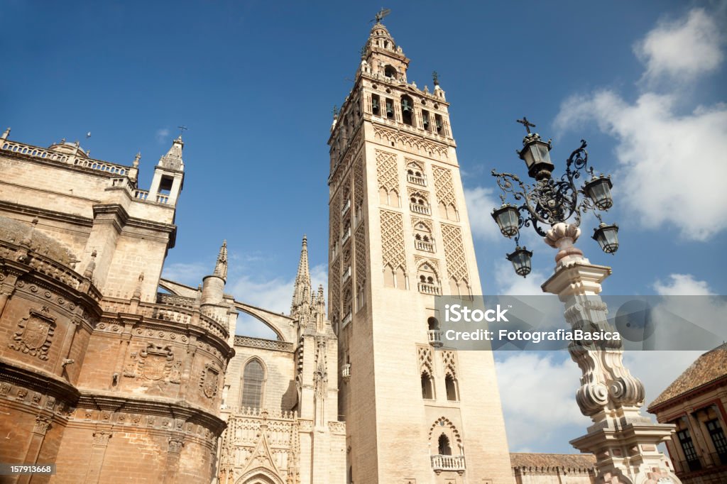 Cathedral and Giralda, Seville, Spain Low angle view of the most emblematic monuments in Seville, the Cathedral and La Giralda located in downtown La Giralda Stock Photo