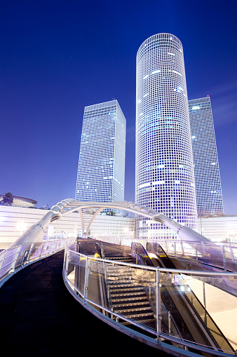 Azrieli Center is a complex of skyscrapers in Tel Aviv. At the base of the center lies a large shopping mall. The center was originally designed by Israeli-American architect Eli Attia.The Azrieli Center is located on a 34,500 square meter site in Tel Aviv, Israel which was previously used as Tel Aviv's dumpster-truck parking garage. The Azrieli Center Circular Tower, is the tallest of the three towers, measuring 187 m (614 ft) in height. Construction of this tower began in 1996 and was completed in 1999. The tower has 49 floors, making it the tallest building in Tel Aviv and the second tallest in Israel