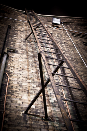 old rail yard workshop ladder at night