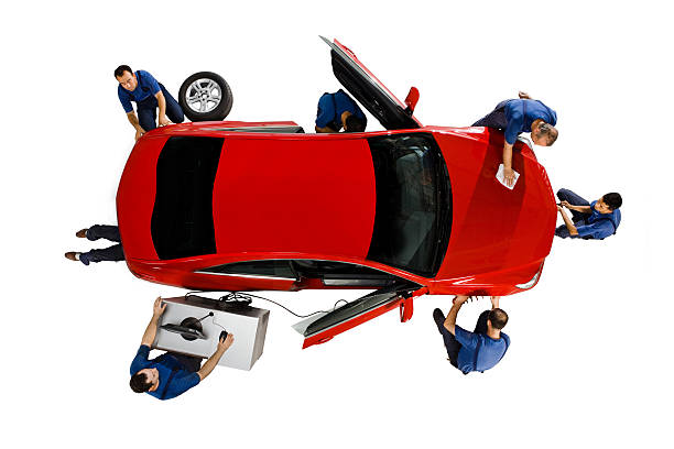 Mechanics working on a car stock photo