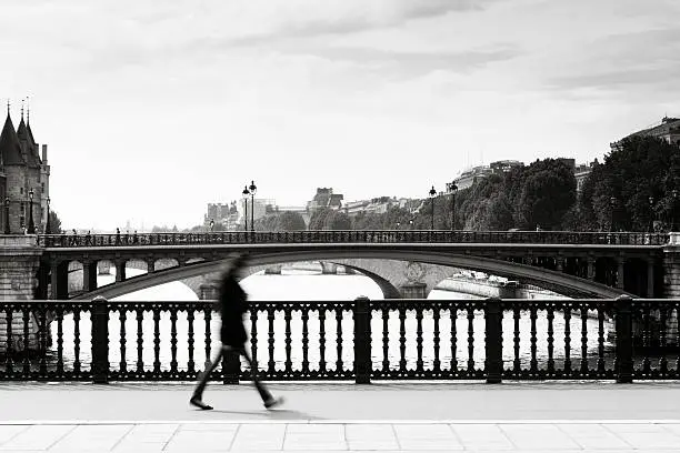 Photo of Paris bridge with commuter