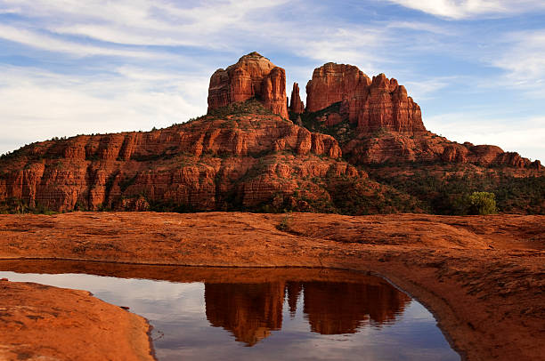 Photo of Cathedral Rock and its reflection in the water Cathedral Rock in Sedona, Arizona. red rocks state park arizona photos stock pictures, royalty-free photos & images