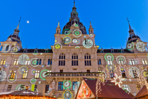The prestigious Town Hall with its dome, its clock and the corner towers has dominated Graz since the late 19th century. At Christmas in the colorful market of the Hauptplatz, the main square in front of the Rathaus, you can enjoy mulled wine and Austrian traditional food, buy handicrafts and spend some time with friends. And on the facade of the City Hall is projected a giant Advent calendar. Graz, Austria. Canon EOS 5D Mark II