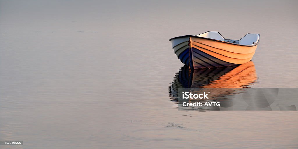 Boat on Lake at Sunset Rowboat Stock Photo