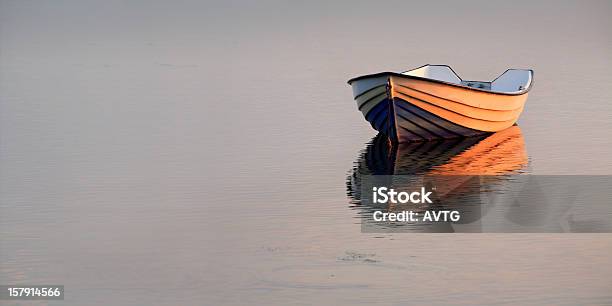 Boat On Lake At Sunset Stock Photo - Download Image Now - Rowboat, Lake, Punting