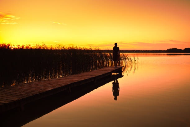 istock Woman on jetty 157914581