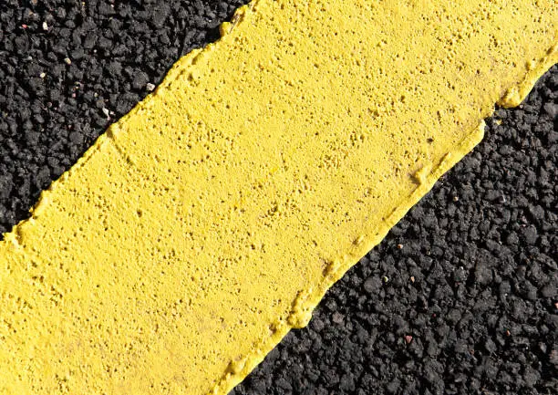 Photo of Extreme Close-up on Yellow Road Marking