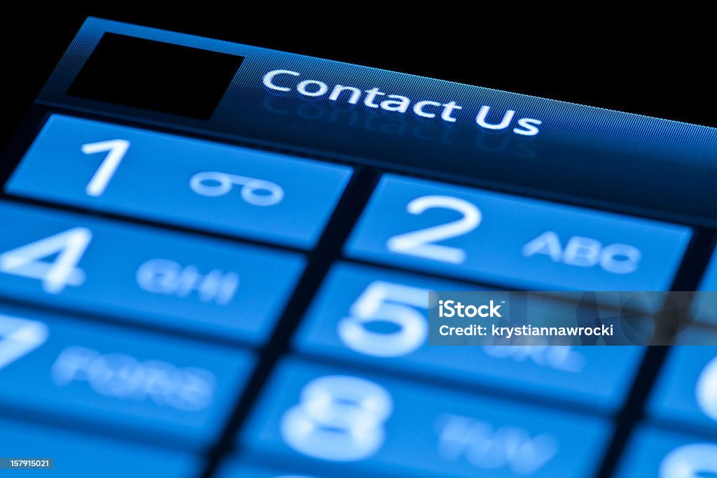 Teléfono en contacto con nosotros - Foto de stock de Contact Us - Frase en inglés libre de derechos