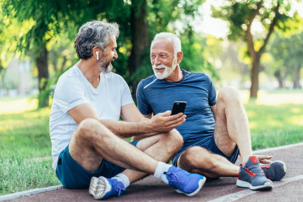 istock Senior friends resting after jogging 1579235818