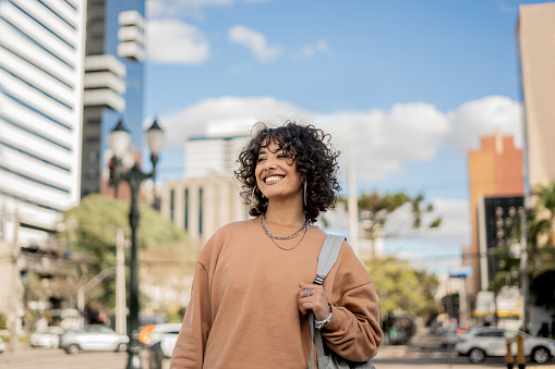 Latin woman portrait in the city