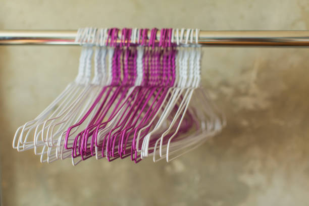 istock Clothes hanger on gray wall background 1579256297