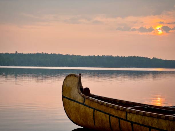 istock Wooden canoe on lake 1579345057