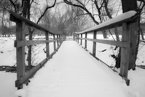 A rural pedestrian bridge in winter