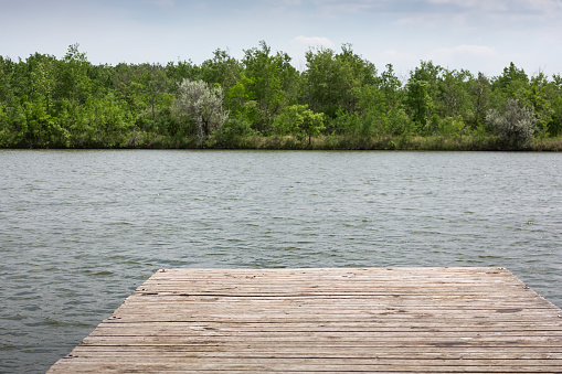 A view of a dock looking onto Muir Lake, seen in Winnipeg, Manitoba.