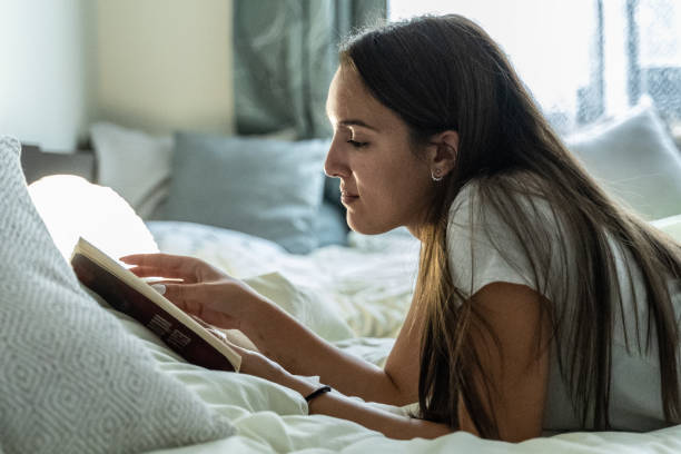 istock Reading a book. Homeschooling Gen Z girl. 1579446401