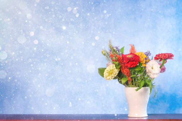 Bouquet of mixed flowers, primarily zinnia  flowers. With copy space for text, storytelling.