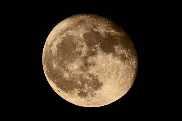 istock Bright moon rising in desert sky 1579530064