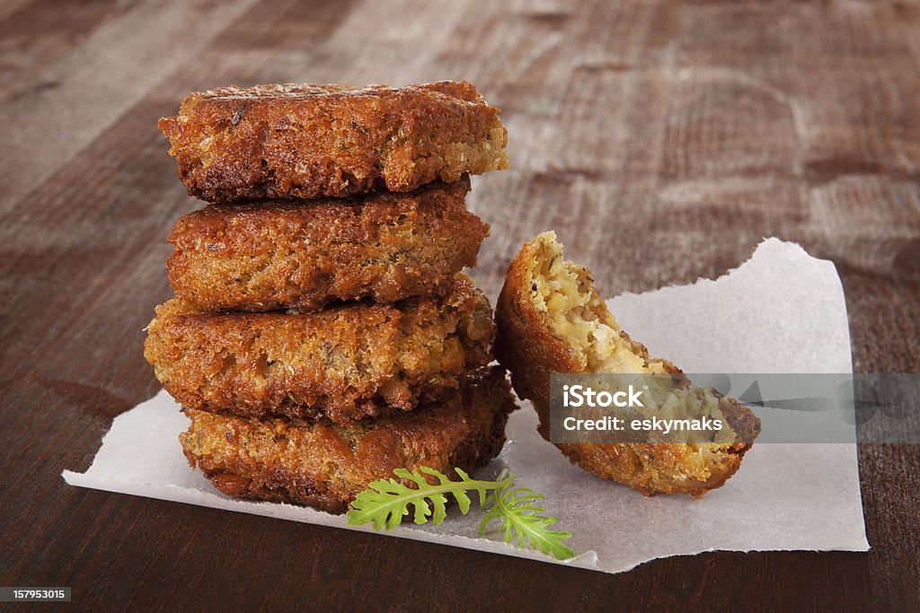 Falafel background, country style. Traditional arab food, falafel with fresh herbs on wooden background. Culinary healthy vegan eating. Appetizer Stock Photo