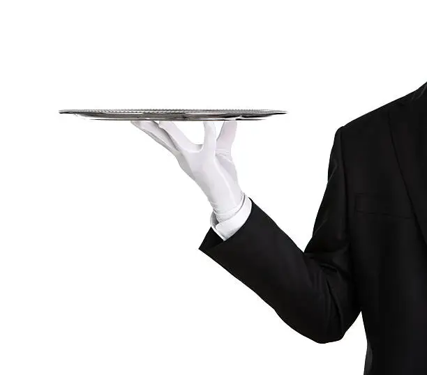 Waiter holding empty silver tray isolated on white background with copy space