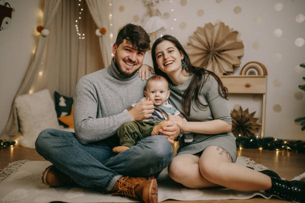 istock Young family on Christmas. 1579576101