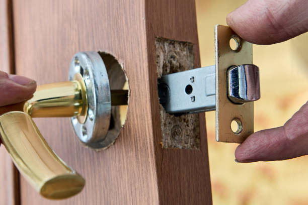 istock Repair of lever door handle with latch. 1579593441