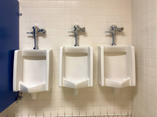 istock three (3) white urinals in a men's bathroom 1579605870