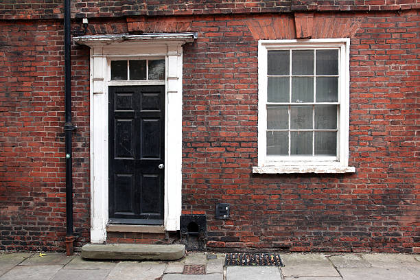 istock Old classic victorian door and window in England 157963691
