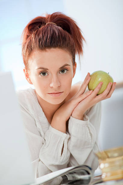 istock Girl with Apple. 157963695