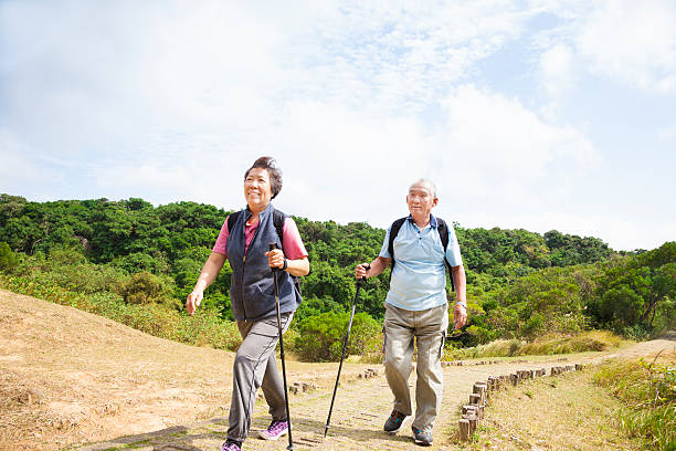istock asian senior couple hiking 157964946