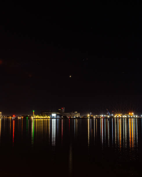 istock Calm port night following stars. 1579682347