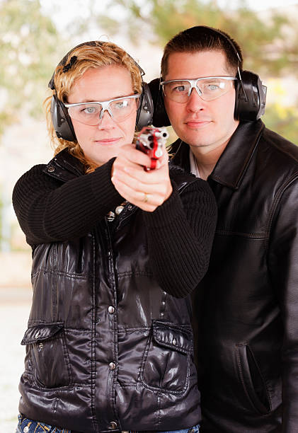 istock Man and Woman at the Shooting Range 157969566