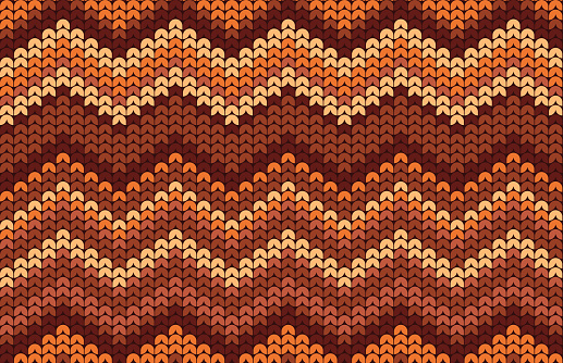 Seamless repeating tileable autumn fall knitted zigzag sweater background pattern.