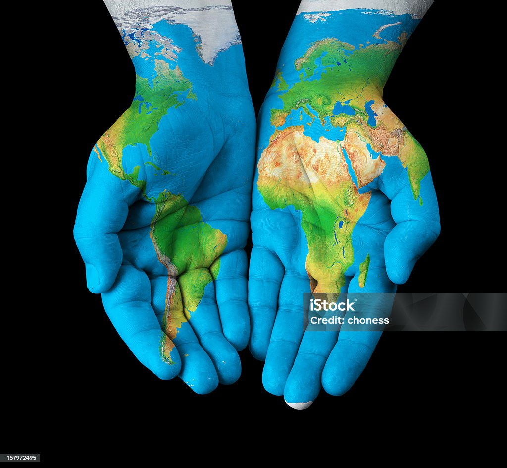 World map painted on hands Map painted on hands showing concept of having the world in our hands. Geographical Locations Stock Photo