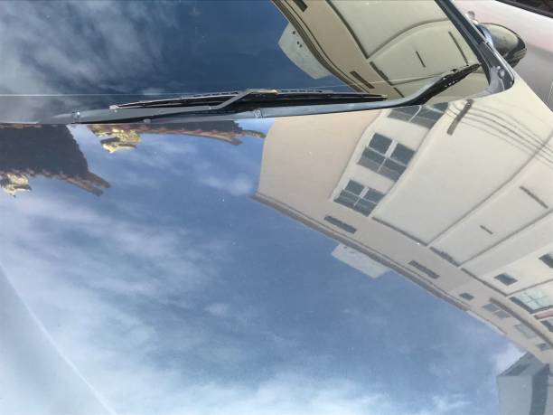 istock Building reflection on the car hood cover 1579754862