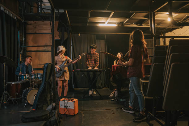 istock Young Asian Multiracial group live band rehearsal at backstage 1579761324