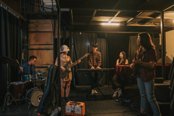 istock Young Asian Multiracial group live band rehearsal at backstage 1579761629